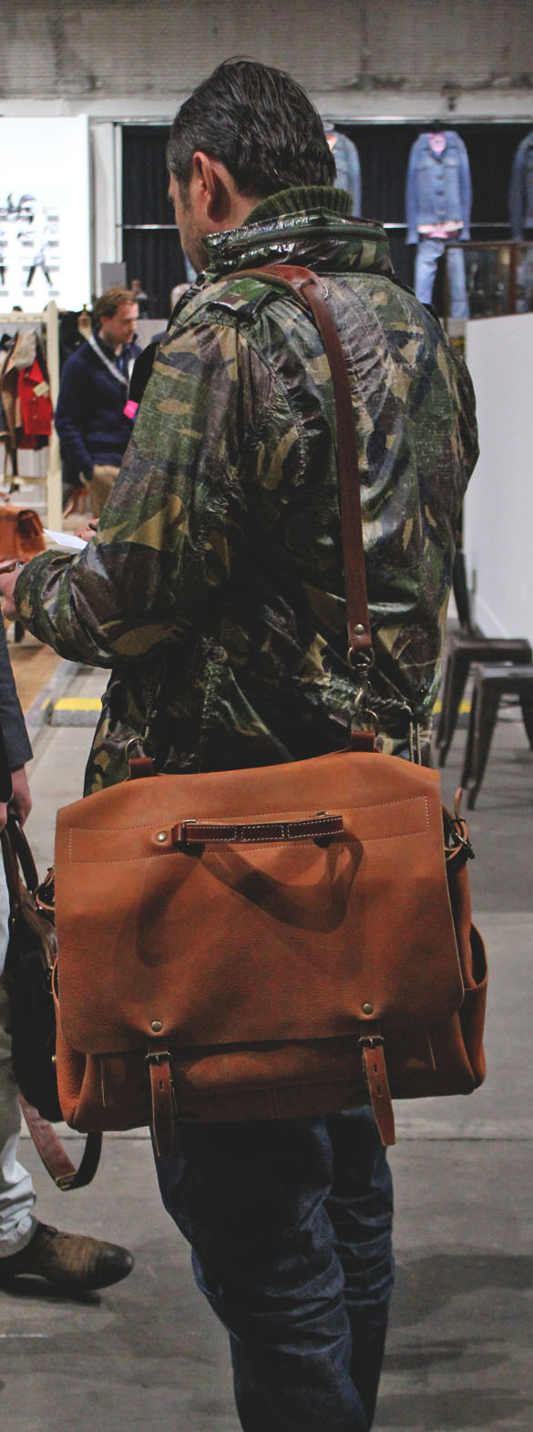 big leather briefcase and camo jacket
